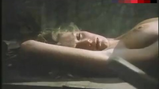 Lana Clarkson Lying Topless on Table – Barbarian Queen Ii