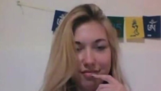 Beautiful blonde teen tastes her pussy