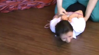 Two girls hogtied and gagged together