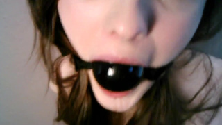 Ball-gagged excessive drooling
