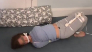 Hogtied with vibrator and cleave-gagged