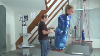 Girl gets wrapped hogtied in Saran wrap