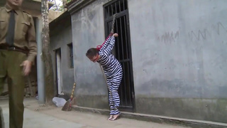 Chinese prison girl in metal bondage