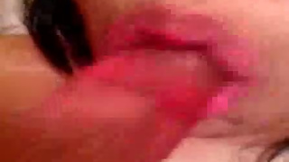 Girl mouth fucks herself with a dildo
