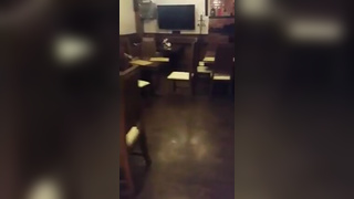 Unconscious girl stripped on table in a restaurant