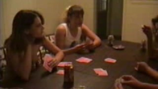 Group of girlfriends all play strip poker together