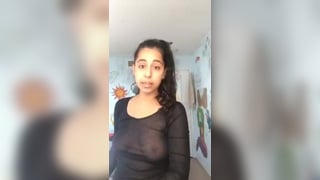 Girl teases her tits in a transparent shirt