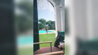 Girlfriend walks topless from the pool