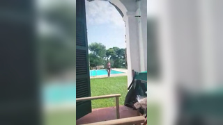 Girlfriend walks topless from the pool