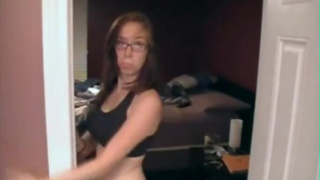 Nerdy girl strips and grinds on her bed for camera