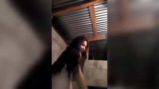 Cute girl streams herself taking a shower in shed