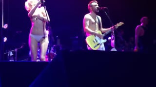 Singer strips totally nude on stage during concert