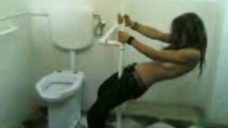 Stripping for her friend in a public bathroom