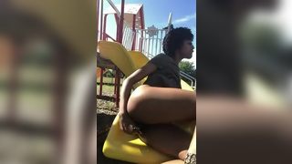 Horny chick fuck her pussy in a public playground - Amateur