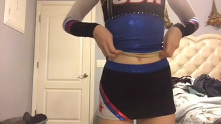 Tiny blonde cheerleader strips