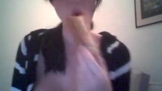 girl eats and plays with her tits on cam